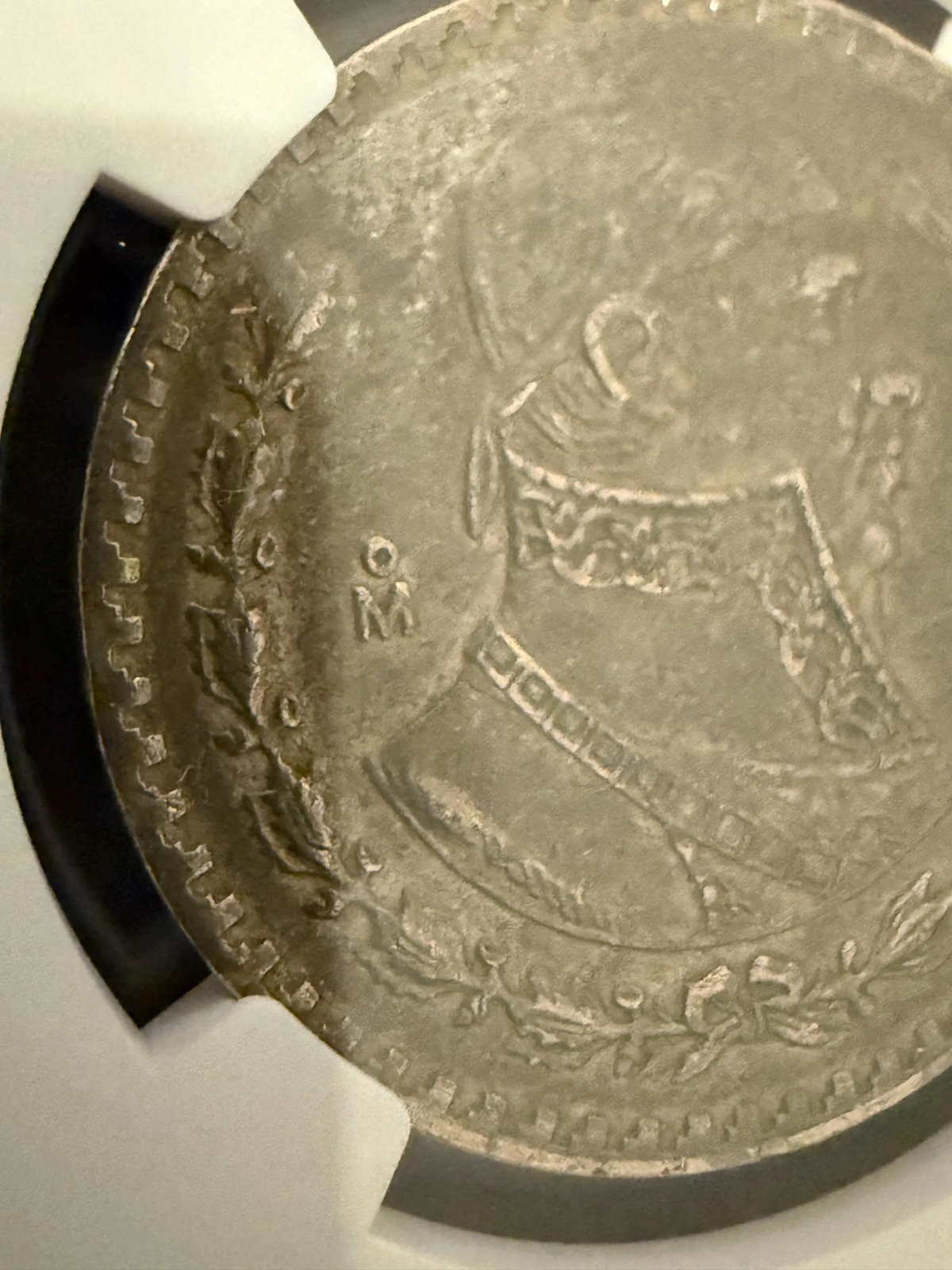 1957 Mo Mexico Silver Peso Jose Morelos NGC Genuine .720 Silver Coin